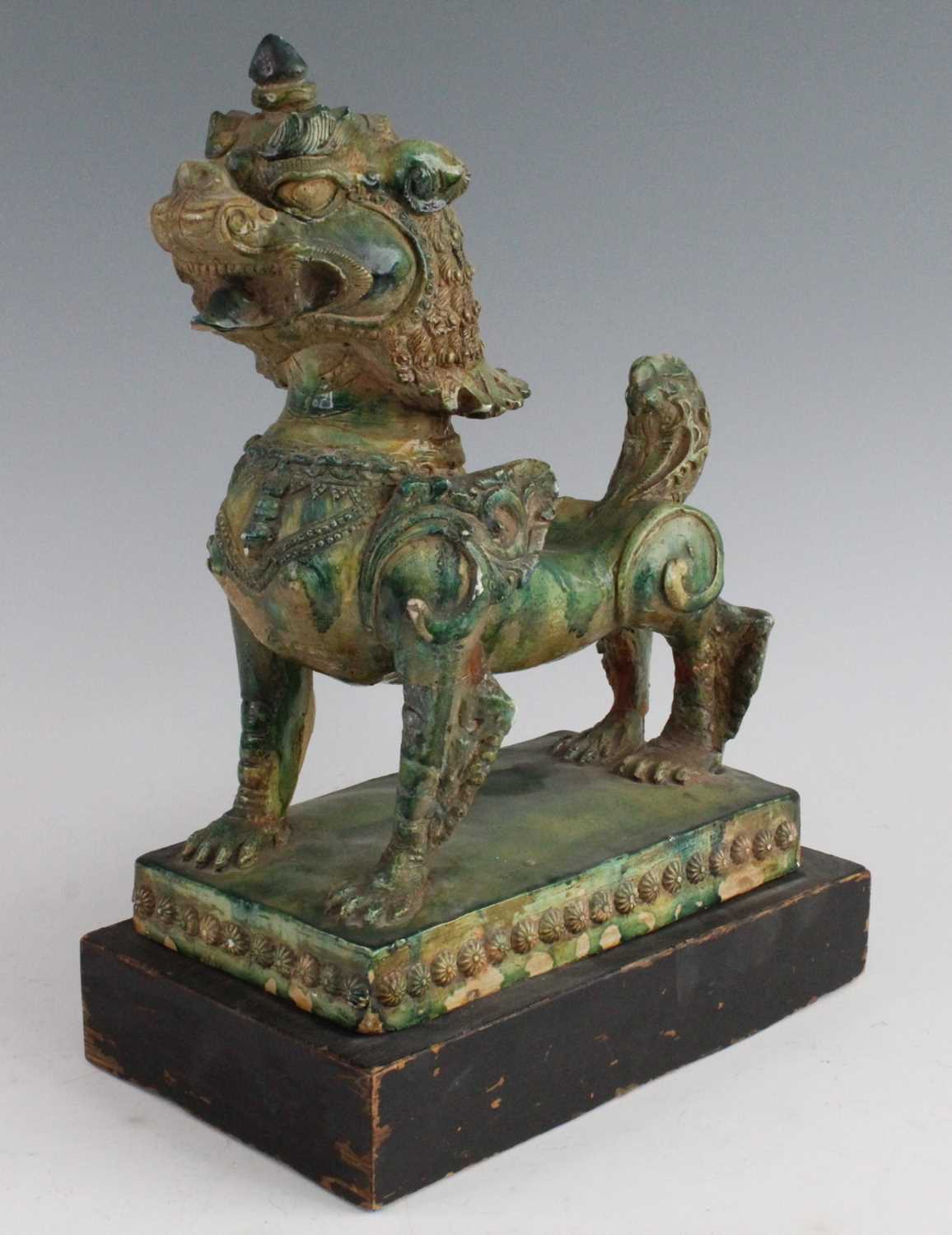 A Chinese green glazed pottery figure of a Fu Lion, modelled in proud standing pose, mounted on a - Image 2 of 12