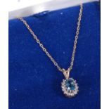 A 9ct gold blue and white stone set pendant, 10 x 8mm (excluding bale), on gilt metal neck chain