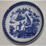 An 18th century Worcester porcelain bowl underglaze blue decorated with a Chinese figure on a junk
