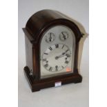 An early 20th century mahogany cased bracket clock, the arched dial with subsidiary speed and