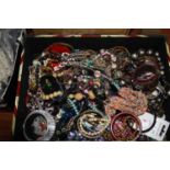 A box of miscellaneous costume jewellery to include various perspex and other bracelets, beaded