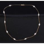 A modern yellow metal and cultured pearl sectional necklace, stamped 375, 4.5g, length 44cm