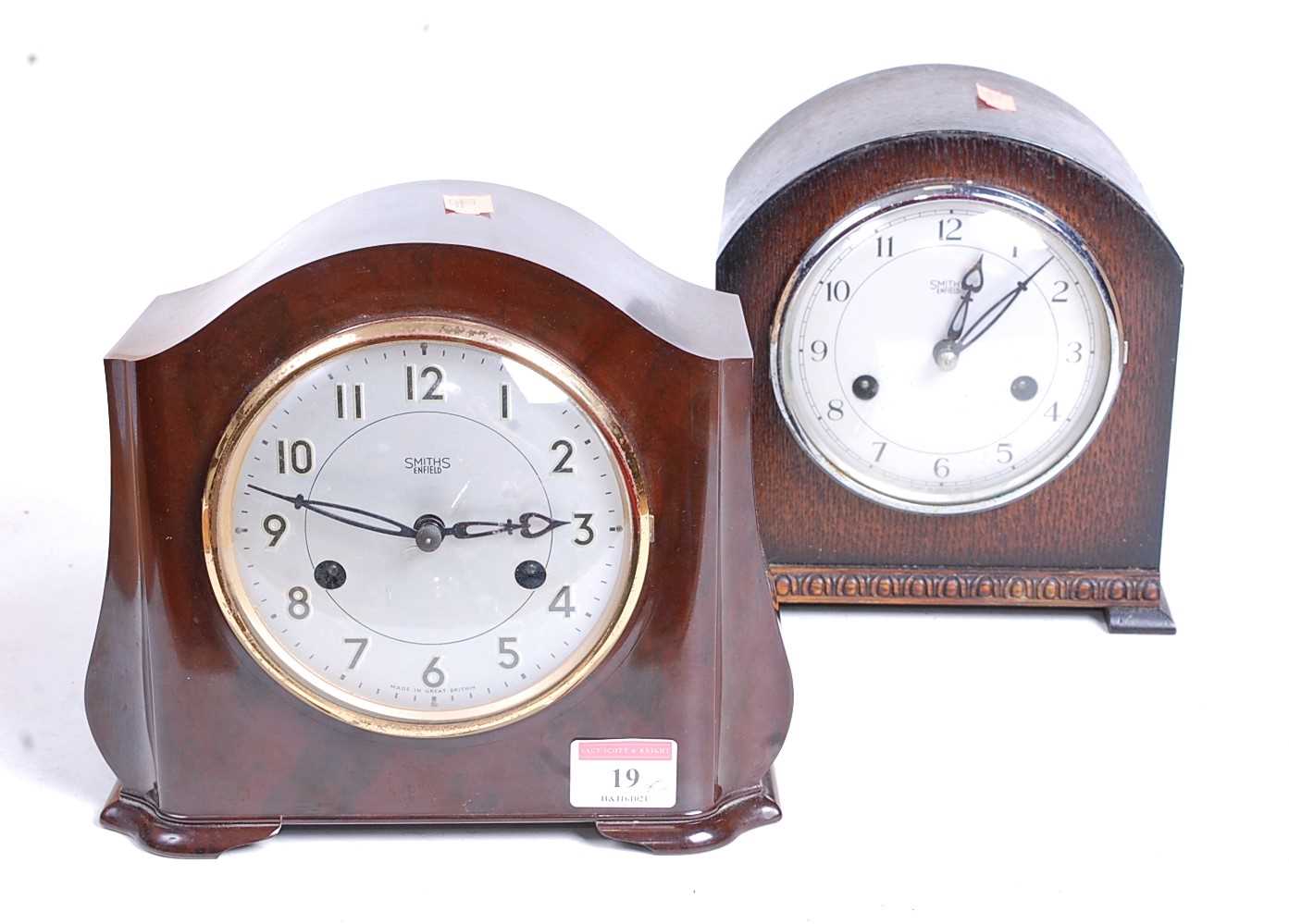 A 1930s bakelite cased eight-day mantel clock, the silvered dial showing Arabic numerals and