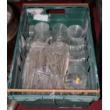 A box containing a collection of various glass laboratory equipment, to include test tubes and