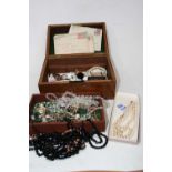 A poker-work box and contents, to include various beaded necklaces, faux pearl necklace, RAF