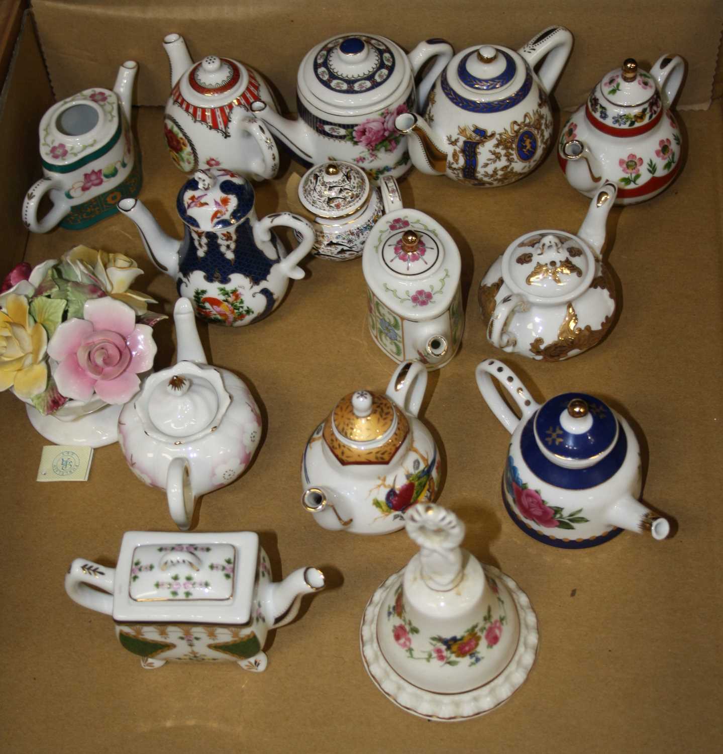 A collection of 20th century miniature porcelain teapots