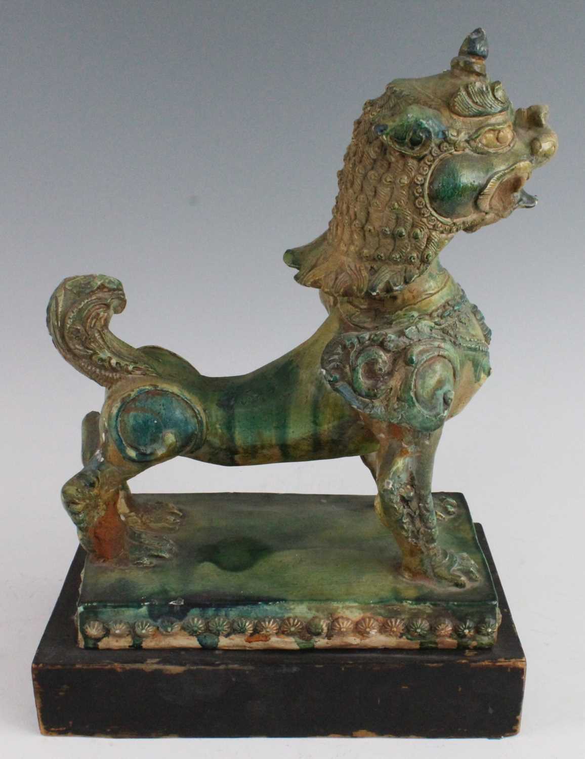 A Chinese green glazed pottery figure of a Fu Lion, modelled in proud standing pose, mounted on a - Image 7 of 12