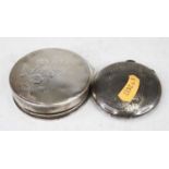 An early 20th century Continental silver ladies powder compact of circular form, the lid with floral
