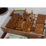 A collection of fret carved wooden doll's house furniture to include table, chairs, dresser, bed,