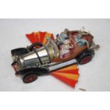 A Corgi Toys diecast model of Chitty Chitty Bang Bang, with four passengers