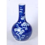 A Chinese blue and white glazed bottle vase, in the Prunus pattern, four character mark to the