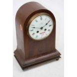 An Edwardian mahogany and chequer strung mantel clock, having a convex enamel dial signed