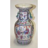A 19th century Chinese Canton Famille Rose vase, the ogee rim above a cylindrical neck, flanked by