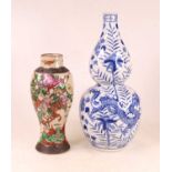 A Chinese export blue and white double-gourd vase, decorated with dragons amidst flowers and