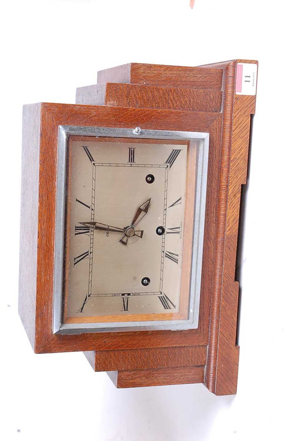 A 1930s Art Deco oak cased mantel clock, of stepped rectilinear form, the eight-day movement with - Image 2 of 3