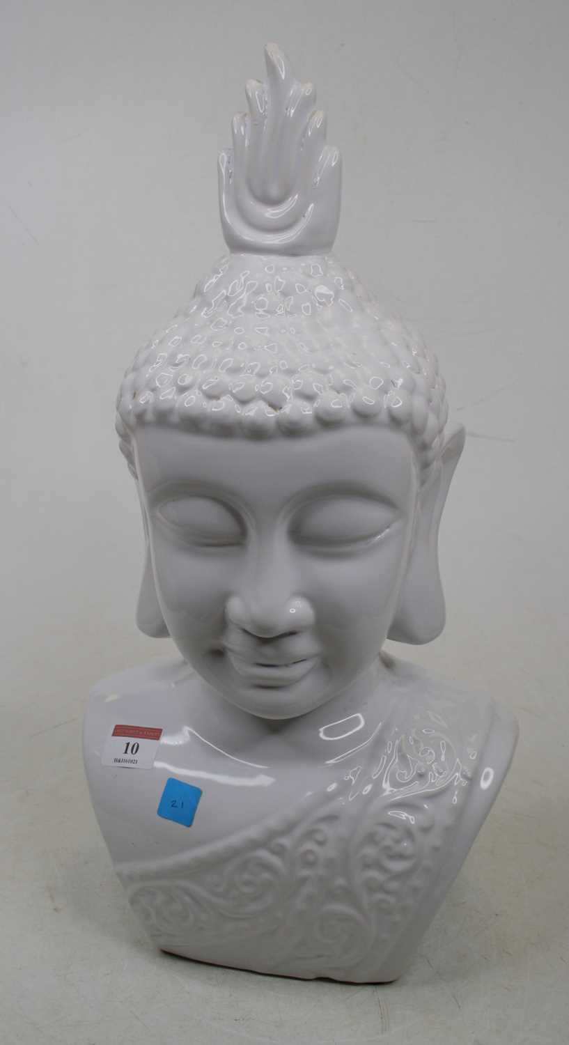 A modern white glazed pottery head and shoulders bust of Buddha, h.44cm