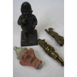An early 20th century cast metal bar top cigar lighter in the form of Mr Punch, registered design