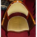 A circa 1900 mahogany and satinwood inlaid tub elbow chair, having green rexine pad back and seat,