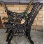 Two pairs of painted cast iron bench end sections, only