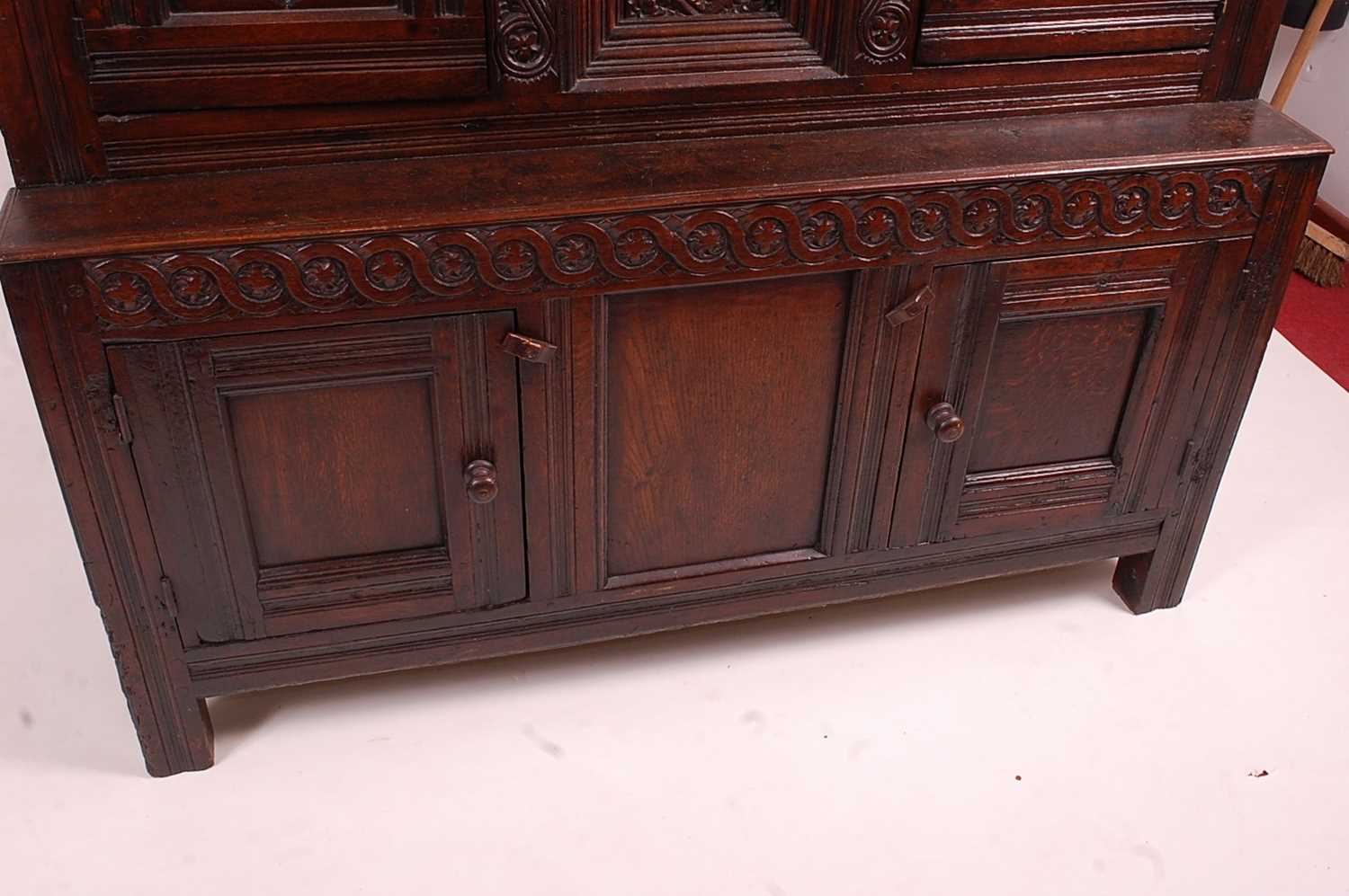 An antique joined oak tridarn, the raised three panel back within turned columns, over two central - Image 2 of 7