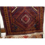 A small Persian brown ground woollen Shiraz rug, 124 x 90cm