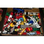 A box of various loose playworn diecast model vehicles, examples by Corgi, Matchbox and others