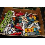 A box of various playworn diecast model vehicles, mostly by Corgi