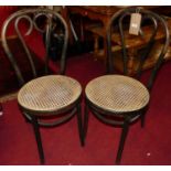 A set of four bentwood cane seat cafe chairs