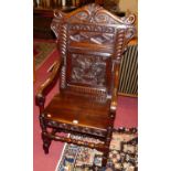 A joined and heavy floral relief carved oak panelled seat Wainscot chair, in the 17th century taste,