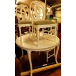 A contemporary white painted French style breakfast suite, comprising circular table, dia.120cm, and