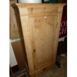 A pine single door wardrobe, with single long lower drawer, w.91cm