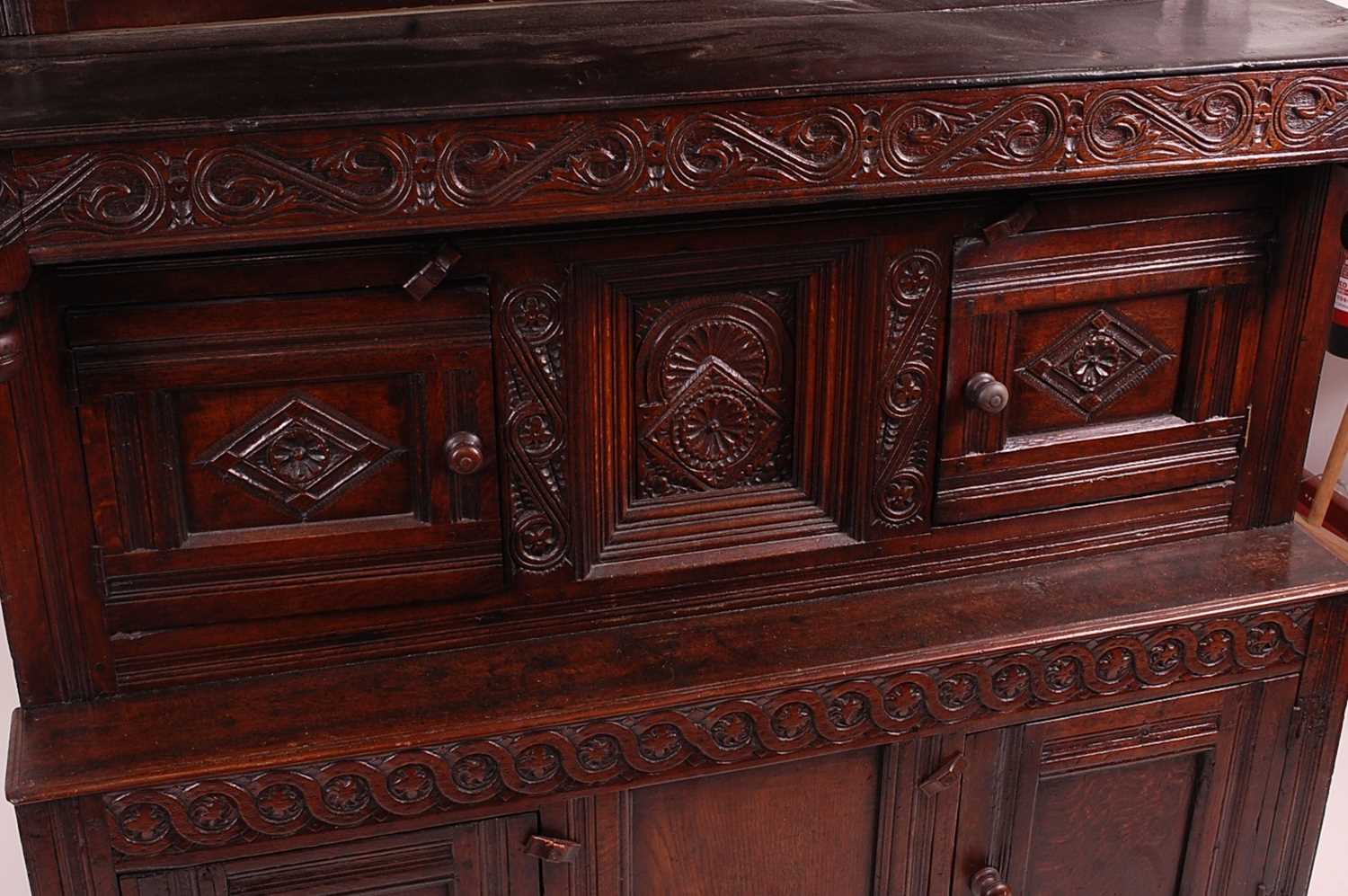 An antique joined oak tridarn, the raised three panel back within turned columns, over two central - Image 5 of 7