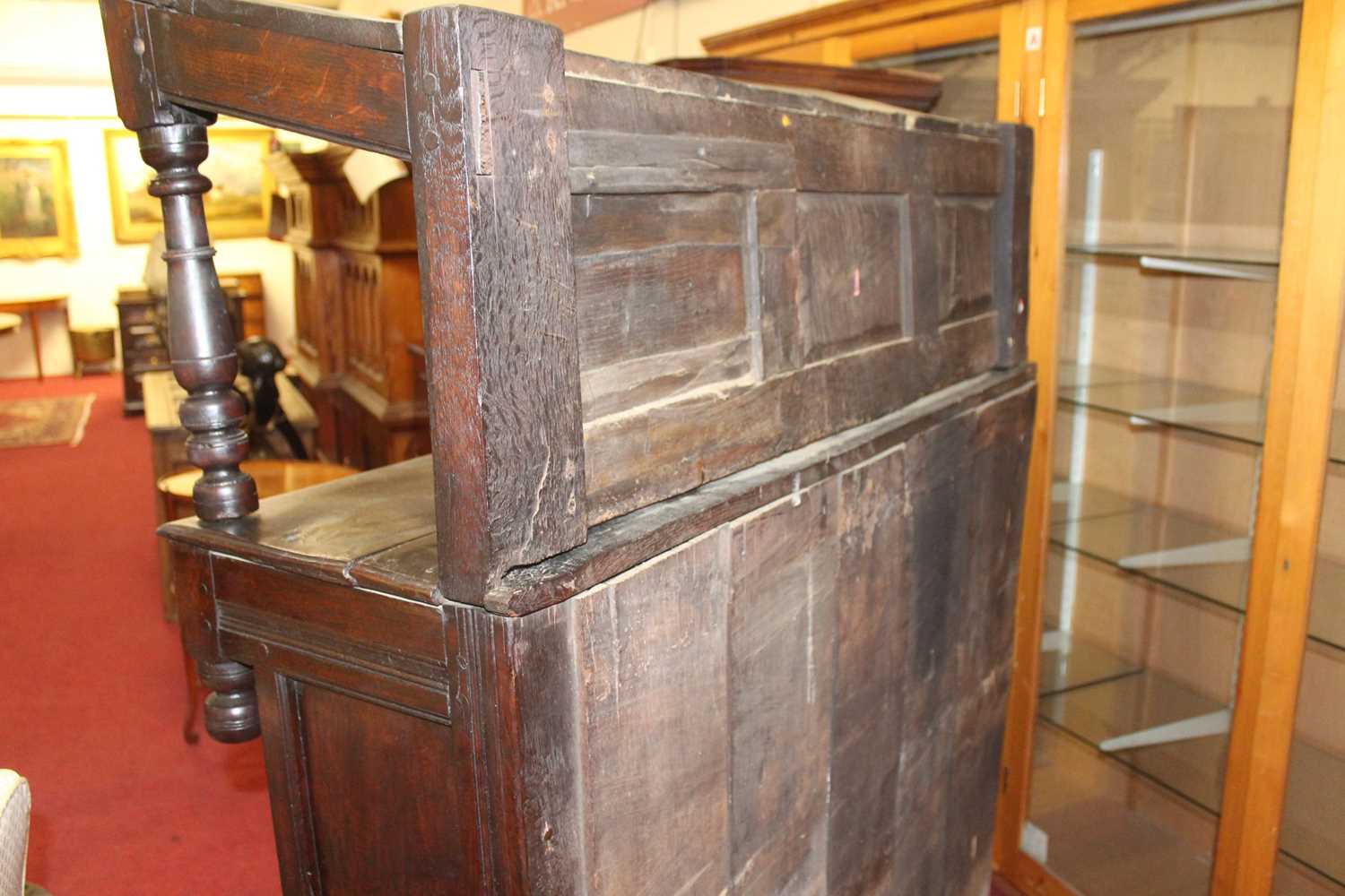 An antique joined oak tridarn, the raised three panel back within turned columns, over two central - Image 3 of 7