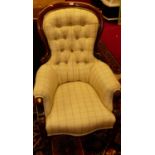 A mid-Victorian mahogany spoonback armchair, with chequered button cream upholstery, w.66cm