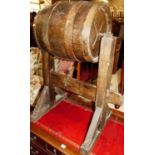 A coopered oak barrel on rustic stand
