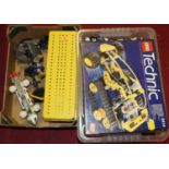 A plastic box of used Lego Technic parts; together with further boxed Lego Technic set; loose