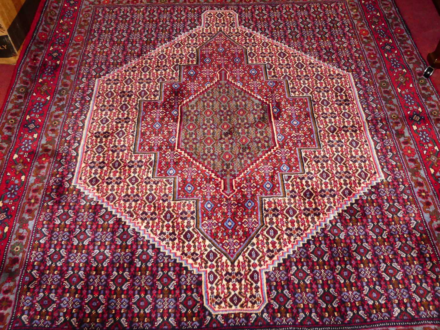 A Persian woollen red ground Senneh rug, 150 x 128cm - Image 3 of 5