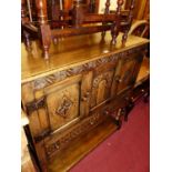 A joined and relief carved oak court cupboard of small proportions in the 17th century taste by