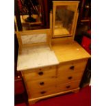 A late Victorian pine and part-white marble topped mirrorback dressing chest, of two short over