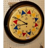 A reproduction circular wall clock, bears RAF painted insignia (with pendulum and key), dia. 38cm