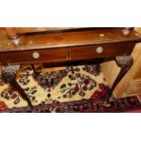 An early 20th century mahogany two-drawer side table, raised on shell and acanthus leaf capped