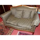 An Edwardian walnut framed and striped re-upholstered two-seater parlour sofa, w.140cm