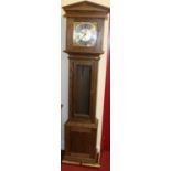 A contemporary oak long case clock, having a silvered and brass dial, striking and chiming