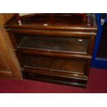 A 1930s Globe Wernicke style oak two-tier stacking bookcase, having glazed hinge doors with single