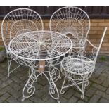 A painted wired metal circular garden patio table, dia. 70cm, together with a pair of near