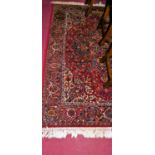 A contemporary Persian style machine-woven red ground Tabriz rug (European manufactured), 195 x