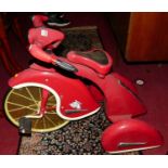 An Airflow Collectables child's red painted metal tricycleCondition report: Overall condition is