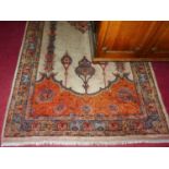 A Persian style machine-made woollen rug, 195 x 132cm