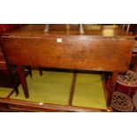 An early 19th century provincial elm and oak dropleaf side table, w.99cm