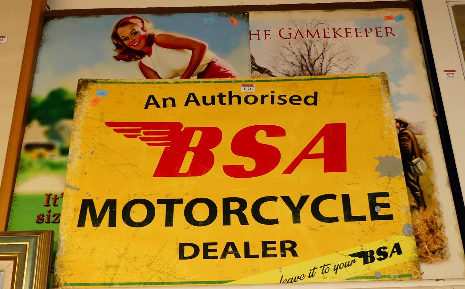 A reproduction printed tin advertising sign for BSA motorcycles 48x70cm, and two others (3)